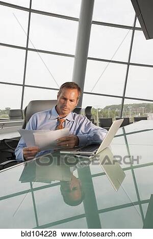 Caucasian businessman working in conference room View Large Photo Image Stock Photo - Caucasian businessman working in conference room. Fotosearch