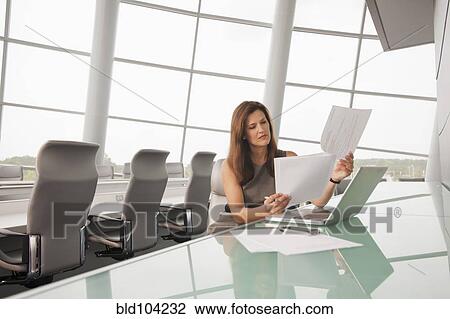 Caucasian businesswoman working in conference room View Large Photo Image Stock Image - Caucasian businesswoman working in conference room. Fotosearch