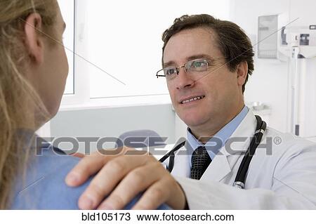 Caucasian doctor examining teenage girl View Large Photo Image Stock Image - Caucasian doctor examining teenage girl. Fotosearch