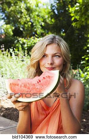 Caucasian girl eating watermelon View Large Photo Image Stock Photo - Caucasian girl eating watermelon. Fotosearch