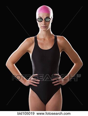 Stock Photo - Caucasian swimmer in swim cap and goggles. Fotosearch