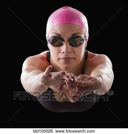 Stock Photograph - Caucasian swimmer in swim cap and goggles. Fotosearch