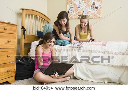 Caucasian teenage girls hanging out in bedroom View Large Photo Image Picture - Caucasian teenage girls hanging out in bedroom. Fotosearch