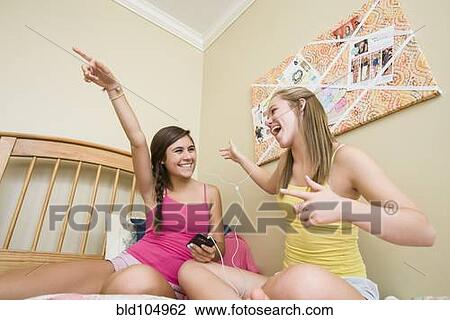 Caucasian teenage girls listening to music View Large Photo Image Stock Image - Caucasian teenage girls listening to music. Fotosearch
