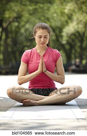 Caucasian woman practicing yoga in park View Large Photo Image Stock Photography - Caucasian woman practicing yoga in park. Fotosearch