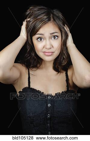 Stock Photo - Confused mixed race woman. Fotosearch