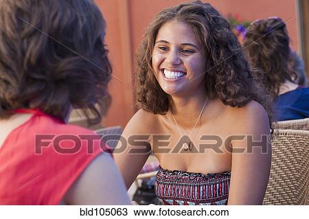 Friends at outdoor cafe View Large Photo Image Stock Image - Friends at outdoor cafe. Fotosearch