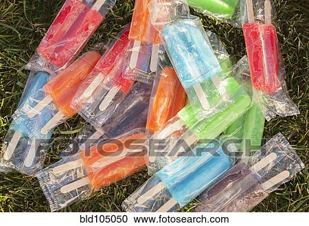 Frozen popsicles on the grass View Large Photo Image Stock Image - Frozen popsicles on the grass. Fotosearch