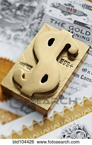 Gold ingot with dollar sign symbol View Large Photo Image Stock Photograph - Gold ingot with dollar sign symbol. Fotosearch