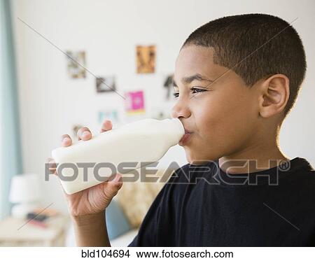 Picture - Hispanic boy drinking milk. Fotosearch