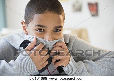 Hispanic boy hiding his face View Large Photo Image Stock Photo - Hispanic boy hiding his face. Fotosearch