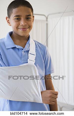 Hispanic boy with arm in sling View Large Photo Image Picture - Hispanic boy with arm in sling. Fotosearch