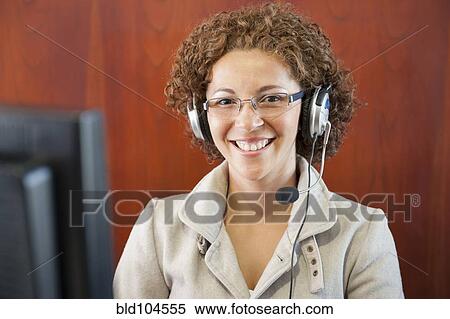 Hispanic businesswoman in headset View Large Photo Image Stock Photography - Hispanic businesswoman in headset. Fotosearch