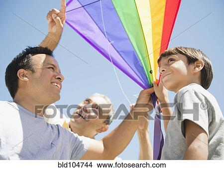 Hispanic grandfather, father and son flying kite View Large Photo Image Picture - Hispanic grandfather, father and son flying kite. Fotosearch