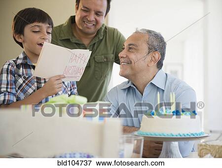 Hispanic grandfather, father and son celebrating birthday View Large Photo Image Stock Photo - Hispanic grandfather, father and son celebrating birthday. Fotosearch