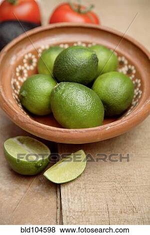 Limes in bowl View Large Photo Image Stock Photo - Limes in bowl. Fotosearch