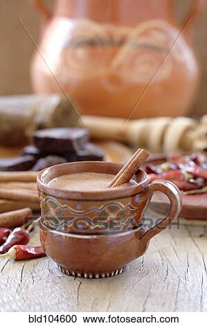 Stock Image - Mexican hot chocolate with cinnamon and chilis. Fotosearch