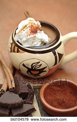 Mexican hot chocolate with cinnamon sticks and chocolate View Large Photo Image Stock Photo - Mexican hot chocolate with cinnamon sticks and chocolate. Fotosearch