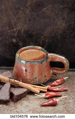 Mexican hot chocolate with cinnamon sticks and chilis View Large Photo Image Stock Photograph - Mexican hot chocolate with cinnamon sticks and chilis. Fotosearch