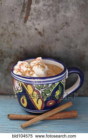 Stock Photography - Mexican hot chocolate with cinnamon sticks. Fotosearch