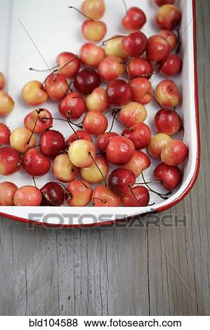 Stock Photo - Rainier cherries in pan. Fotosearch