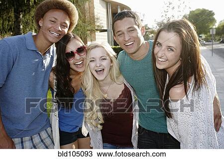 Stock Image - School friends standing together. Fotosearch