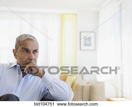 Stock Image - Serious Hispanic man. Fotosearch