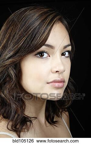 Serious mixed race woman View Large Photo Image Stock Photograph - Serious mixed race woman. Fotosearch