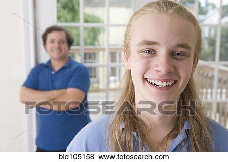 Stock Photo - Smiling Caucasian father and son. Fotosearch