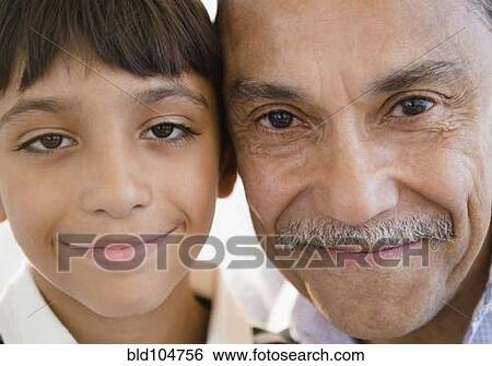 Smiling Hispanic grandfather and grandson View Large Photo Image Stock Photograph - Smiling Hispanic grandfather and grandson. Fotosearch