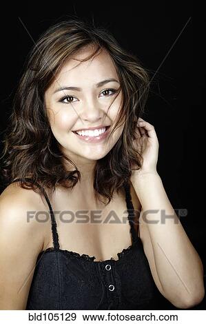 Smiling mixed race woman View Large Photo Image Stock Photo - Smiling mixed race woman. Fotosearch