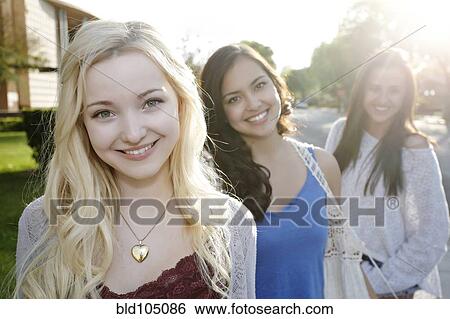 Stock Photograph - Smiling school friends. Fotosearch