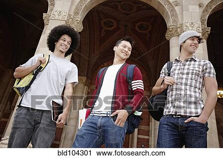 Stock Image - Students standing outdoors together on campus. Fotosearch