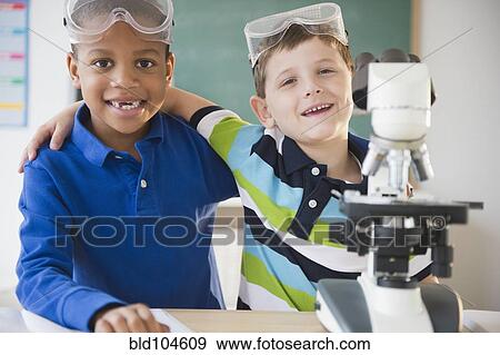 Stock Photo - Students working together in science class. Fotosearch
