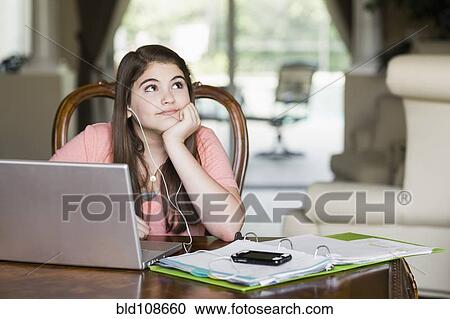 Bored Caucasian girl doing homework View Large Photo Image Stock Image - Bored Caucasian girl doing homework. Fotosearch