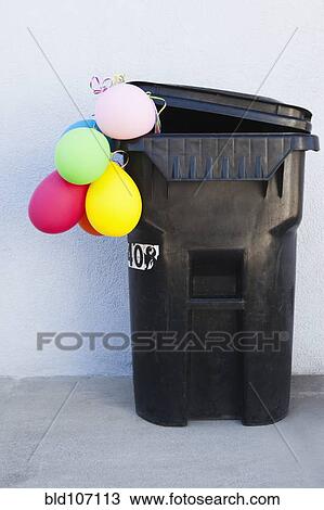 Bunch of balloons in garbage can View Large Photo Image Stock Image - Bunch of balloons in garbage can. Fotosearch