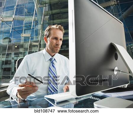 Caucasian businessman shopping online View Large Photo Image Stock Photo - Caucasian businessman shopping online. Fotosearch