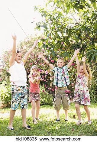Caucasian children playing in garden View Large Photo Image Stock Photography - Caucasian children playing in garden. Fotosearch