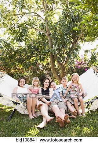 Caucasian children sitting in hammock View Large Photo Image Stock Image - Caucasian children sitting in hammock. Fotosearch