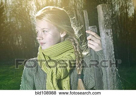 Stock Photo - Caucasian girl standing outdoors. Fotosearch