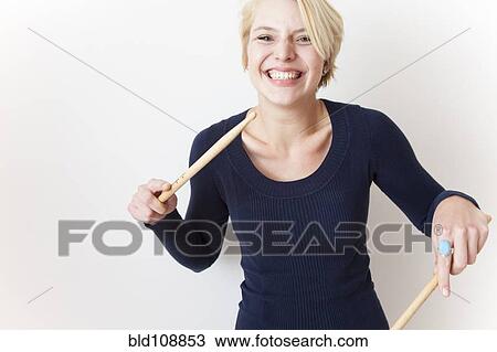 Caucasian woman playing with drumsticks View Large Photo Image Stock Image - Caucasian woman playing with drumsticks. Fotosearch