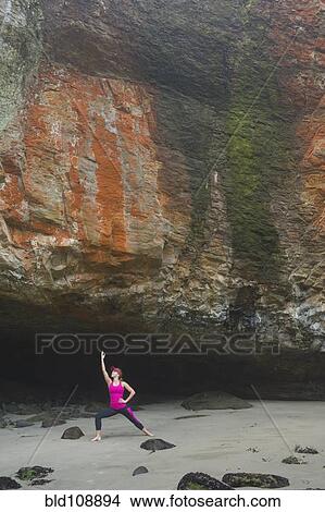 Caucasian woman practicing yoga by rock formations View Large Photo Image Picture - Caucasian woman practicing yoga by rock formations. Fotosearch