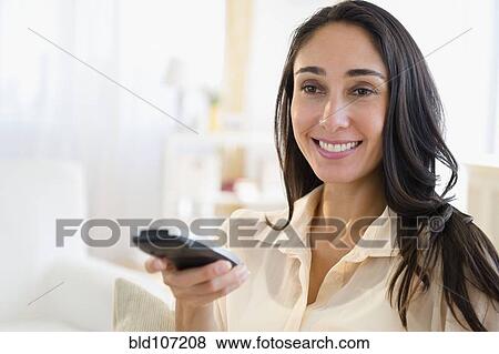 Caucasian woman watching television View Large Photo Image Stock Photo - Caucasian woman watching television. Fotosearch