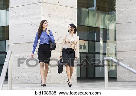 Hispanic businesswomen walking together View Large Photo Image Stock Photo - Hispanic businesswomen walking together. Fotosearch