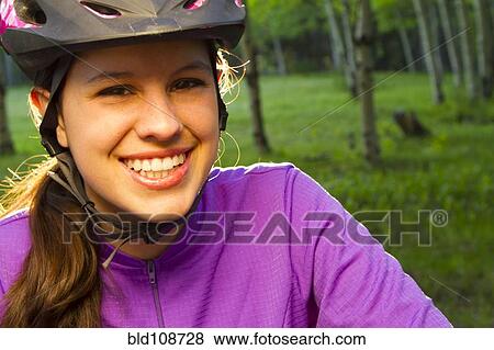 Hispanic teenager riding bicycle in woods View Large Photo Image Stock Photo - Hispanic teenager riding bicycle in woods. Fotosearch