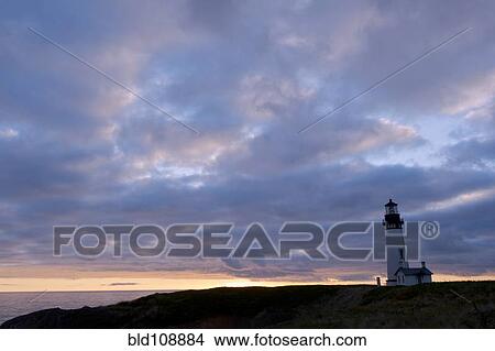 Lighthouse under cloudy sky View Large Photo Image Picture - Lighthouse under cloudy sky. Fotosearch