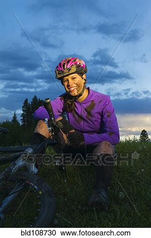 Muddy Hispanic teenager riding bicycle View Large Photo Image Stock Image - Muddy Hispanic teenager riding bicycle. Fotosearch