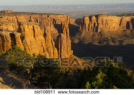 Rock formations in desert valley View Large Photo Image Stock Image - Rock formations in desert valley. Fotosearch