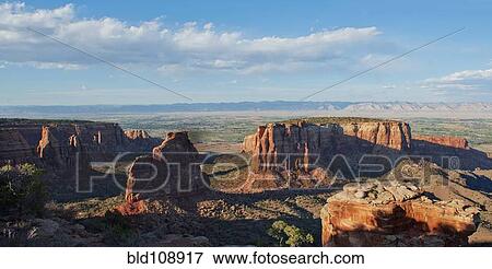 Rock formations in desert valley View Large Photo Image Stock Photo - Rock formations in desert valley. Fotosearch