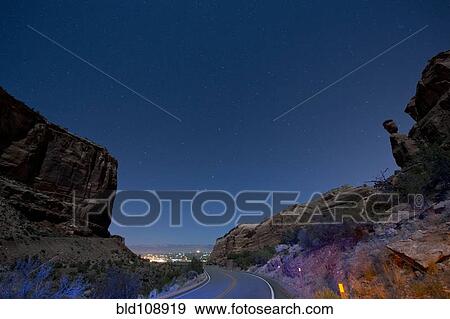 Rock formations in desert valley View Large Photo Image Stock Photo - Rock formations in desert valley. Fotosearch